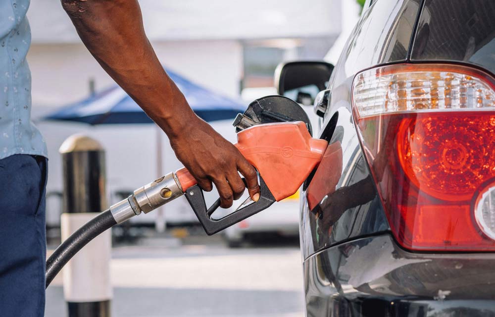 Man refuelling car at a gas station